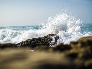 wave crushing on a rock