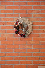 A festive wreath of Christmas baubles as a decoration for Christmas.