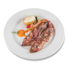 Grilled pork tenderloin with baked potato and vegetables.