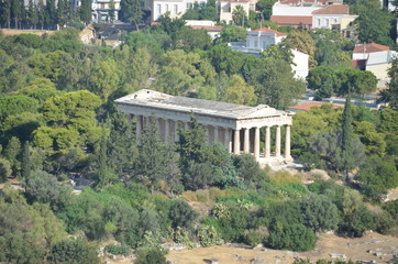 Greek temple surrounded by trees in Athens Greece.