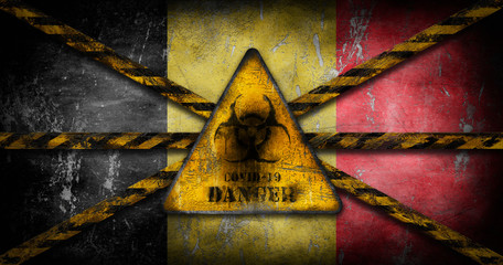 Coronavirus COVID-19 outbreak. Worn Yellow Biohazard, danger, warning sign over flag of Belgium. Restricted area, quarantine alert. Infected zone lockdown 3D illustration