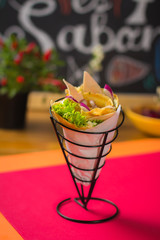 chicken crepe with lettuce and red onion