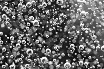 Blurred black and white background. Macro Oxygen bubbles in water.  Concept such as ecology