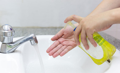 Young women wash their hands with soap to prevent bacterial and viral infections Corona or Covid-19, Inhibiting the spread and protection of the virus concept..