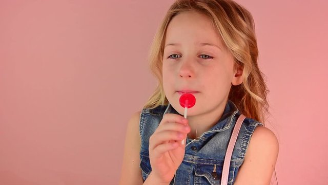 Portrait of a beautiful charming cheerful girl dreaming of becoming a singer