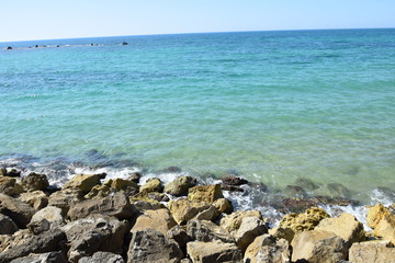 The green-blue rocky beach shore near Tel Aviv