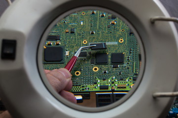 Fototapeta premium Fix and repair of electronic computer board