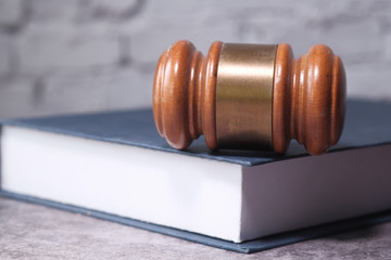 Close up of gavel on a book on table 