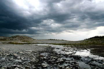 A creek with an incoming thunderstorm runs through Frisco, TX - obrazy, fototapety, plakaty