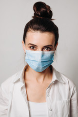 Portrait young asian woman wearing hygienic mask to prevent infection isolated on white background.