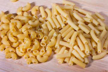 Cooking Dry pasta. A healthy lunch is on the table.