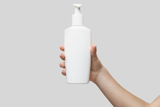 Female Hands Using Hand Sanitizer Gel Or Liquid Soap Dispenser Over Light Grey Background