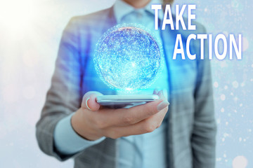 Conceptual hand writing showing Take Action. Concept meaning to do something or act in order to get...