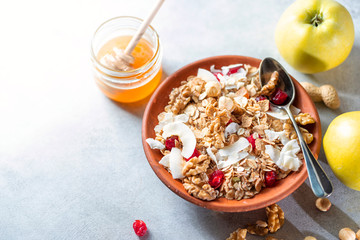 Homemade Nut Granola in a ceramic bowl. Proper and healthy breakfast.