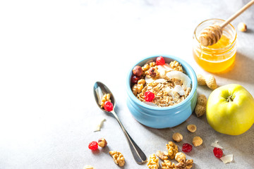 Homemade Nut Granola in a ceramic bowl. Proper and healthy breakfast.