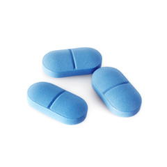 Blue pills isolated on white background