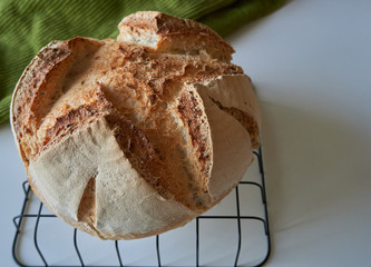 Close Up of freshly baked round bread homemade gluten-free artisan loaf