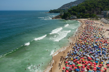 Drone shot of a crowded Leblon beach in Rio de Janeiro Brazil
