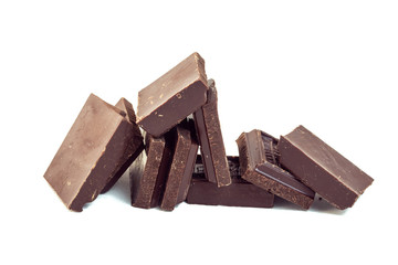 squares of dark brown chocolate are scattered