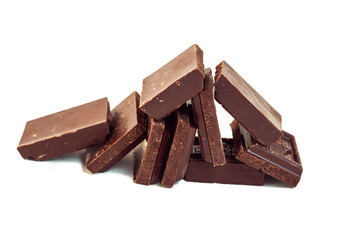 squares of dark chocolate are stacked like dominoes