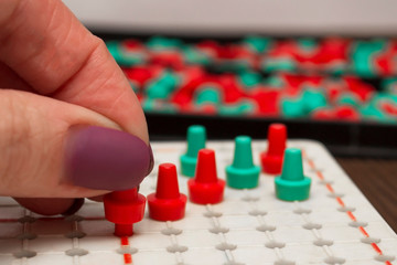 Family plays a five in a row puzzle game