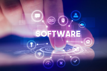 Finger touching tablet with web technology icons and SOFTWARE inscription, web technology concept