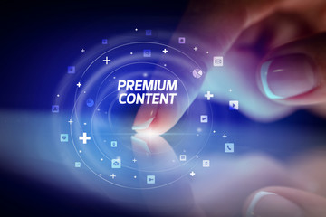 Finger touching tablet with social media icons and PREMIUM CONTENT