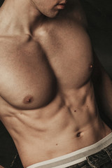 Naklejka premium Topless guy with athletic body