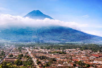 Aerial view of the city of Antigua and Volcano De Agua from Cerro de la Cruz, Guatemala.
