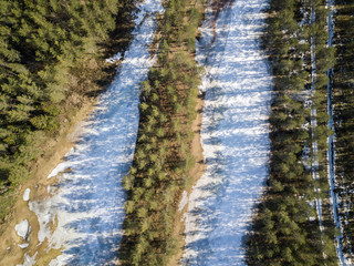 Golf fairways covered by snow in springtime