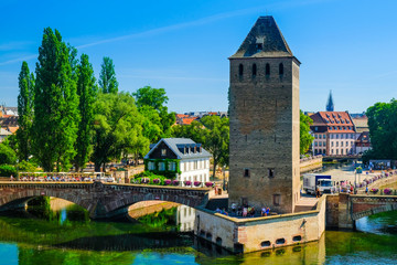 Fototapeta na wymiar Strasbourg, Alsace, France. Old tower over the Ill river.