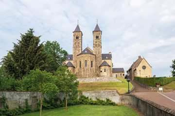 Fototapeta na wymiar Scenic view of the Romanesque basilica in Sint Odiliënberg village, Limburg, The Netherlands