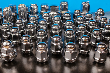 car wheel nuts, closeup abstract background
