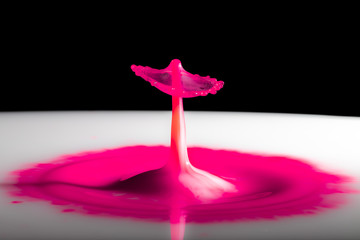 Pink liquid inkdrops collision.