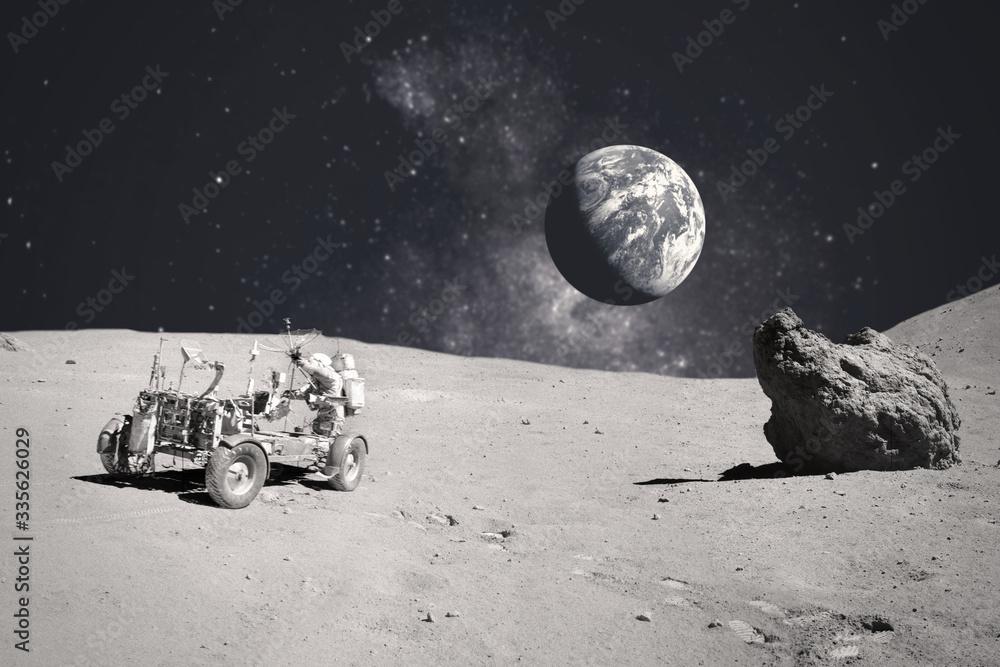 Wall mural astronaut on rock surface with space background. elements of this image furnished by nasa