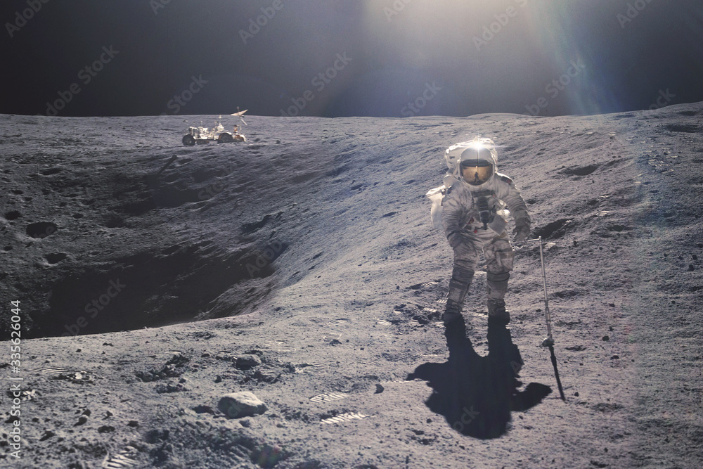 Wall mural astronaut on rock surface with space background. elements of this image furnished by nasa