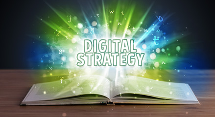 DIGITAL STRATEGY inscription coming out from an open book, educational concept