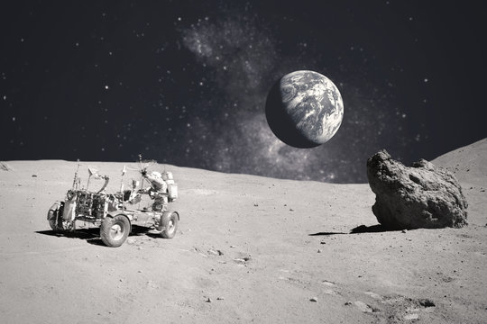 Astronaut on rock surface with space background. Elements of this image furnished by NASA