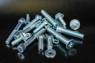 car fasteners of various sizes for repair, bolts and nuts