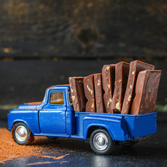 chocolate bar, delicious sweets dessert (transportation of chocolate products in a small car) menu...