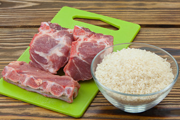 raw red pig meat on  wooden background