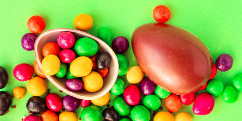 chocolate egg and candy easter decor, menu concept background. top view. copy space