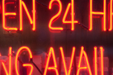 neon deli sign with 24 hour