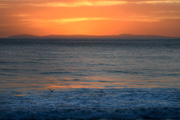 Sunrise or sunset at the beach with a colorful scky 