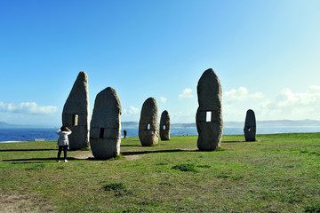 Menhirs of the Sculpture Park of the Tower of Hercules in La Coruña, Galicia. Spain. Europe....