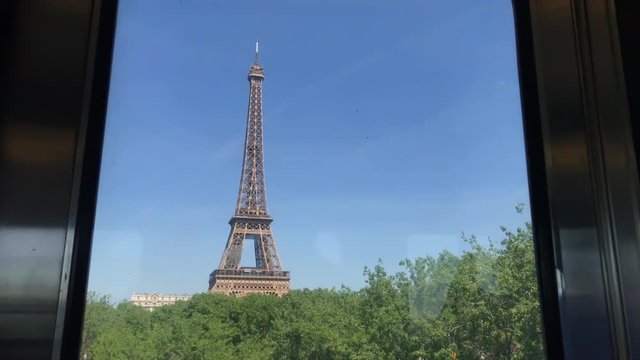 View from the window of parisian metro on the city and Eiffel tower from bridge Bir Hakeim. Eiffel Tower from Metro train. View of the Eiffel Tower shot through the window of a metro train. 