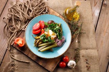 Delicious salad with various tomatoes, salad, cucumber, salad, parsley, onion. Summer salad.