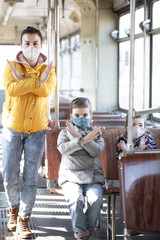 A mother with two children on public transport.