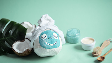 Creative Spa concept .Coconut with a face mask.