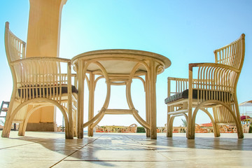 A Chairs with table for eating people business background sea on summer vacation.